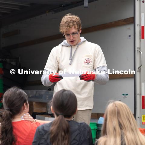 Paul Pechous reads off a list of gear to be handed out to a Big Event volunteer group. May 4, 2024. Photo by Kirk Rangel for University Communication.